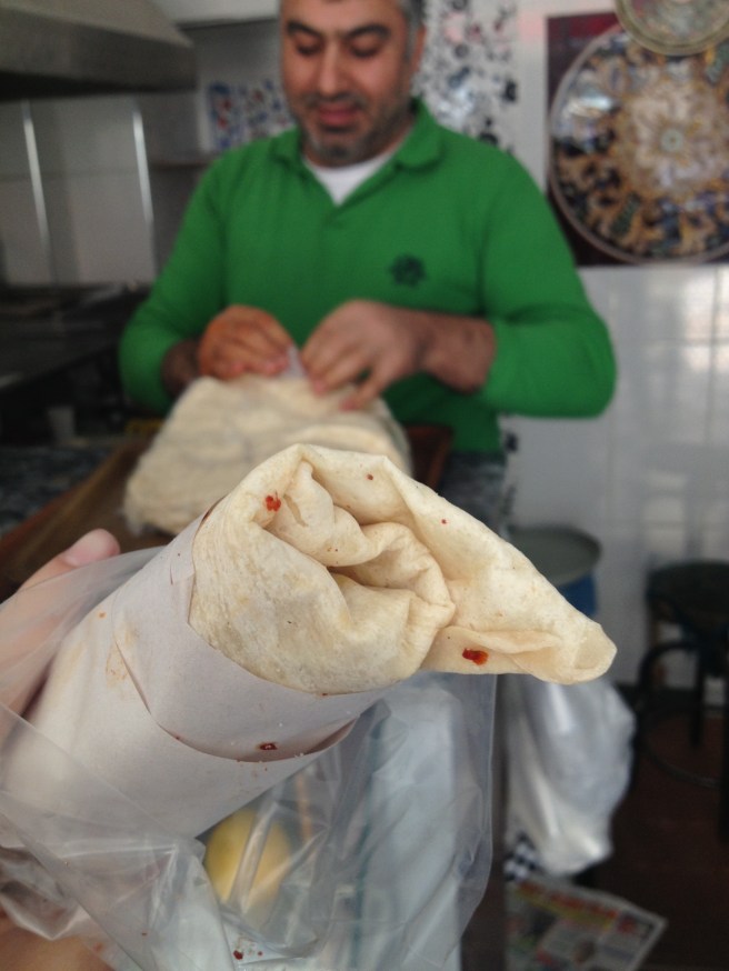 Welcome to our day of epic eating. Best of the best? This spicy meat wrap, courtesy of this guy.
